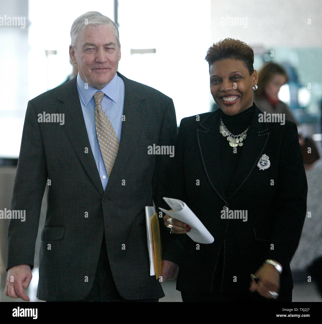 Former CEO of Hollinger International Inc. Conrad Black (L) leaves federal court with an unidentified associate during a recess during the first day of his corruption trial, in Chicago on March 19, 2007. Black is charged with racketeering, mail and tax fraud, money laundering and obstruction of justice. (UPI Photo/Brian Kersey) Stock Photo