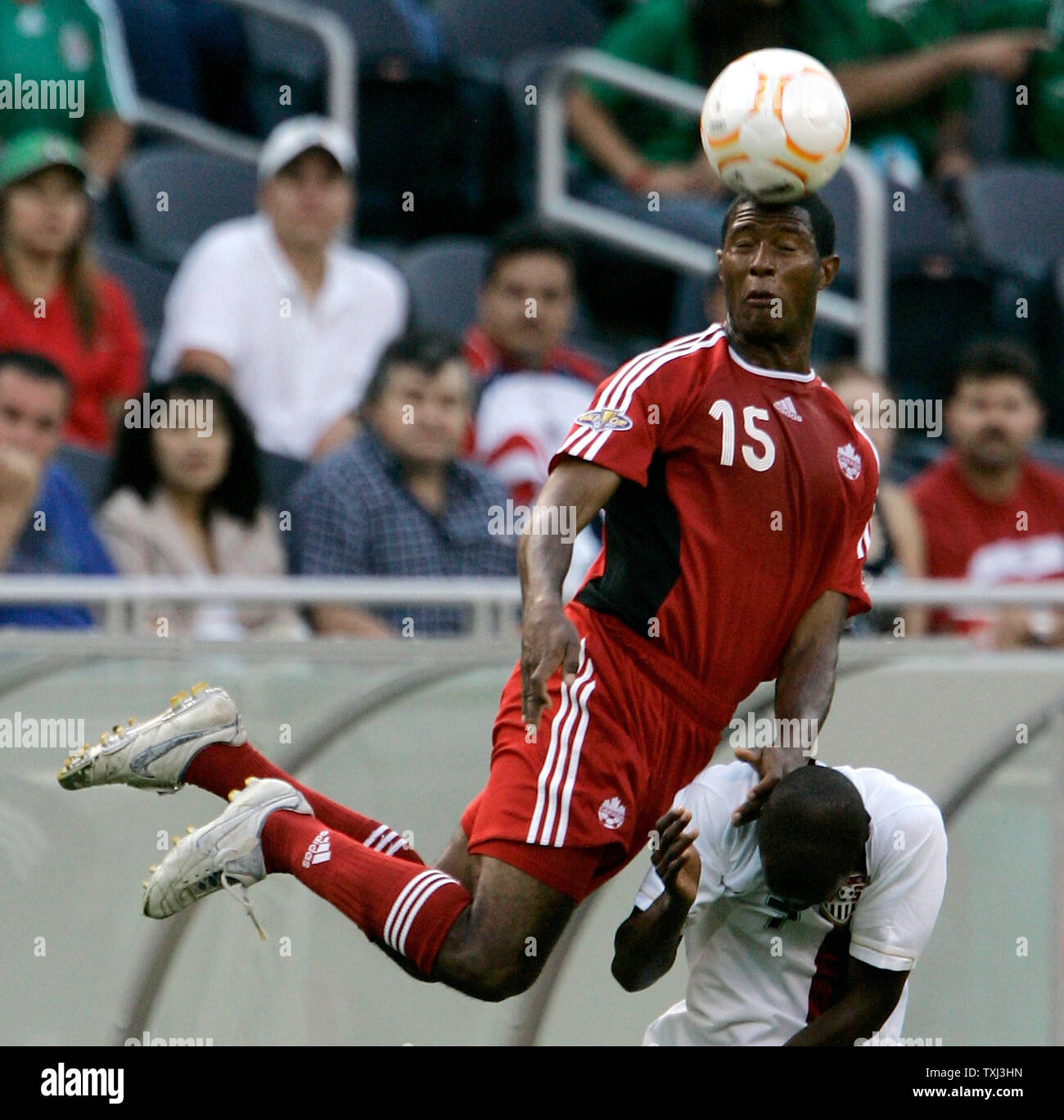 Canada's Patrice Bernier (15) and the United States' DaMarcus Beasley go up for a header during the first half of the CONCACAF Gold Cup semifinal match at Soldier Field in Chicago on June 21, 2007. (UPI Photo/Brian Kersey) Stock Photo
