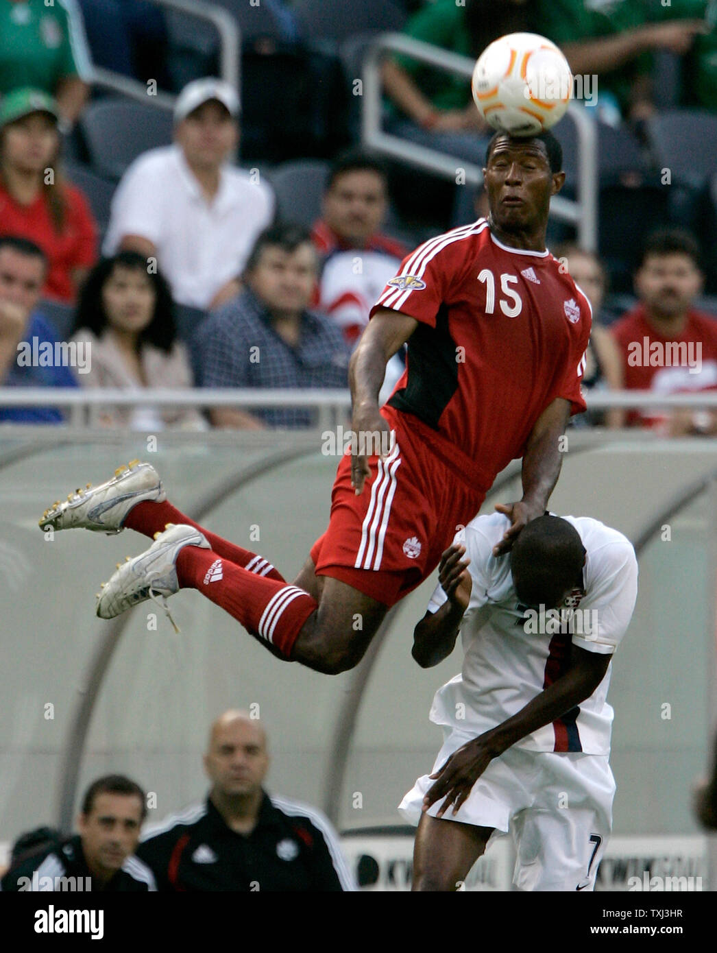 Canada's Patrice Bernier (15) and the United States' DaMarcus Beasley go up for a header during the first half of the CONCACAF Gold Cup semifinal match at Soldier Field in Chicago on June 21, 2007. (UPI Photo/Brian Kersey) Stock Photo
