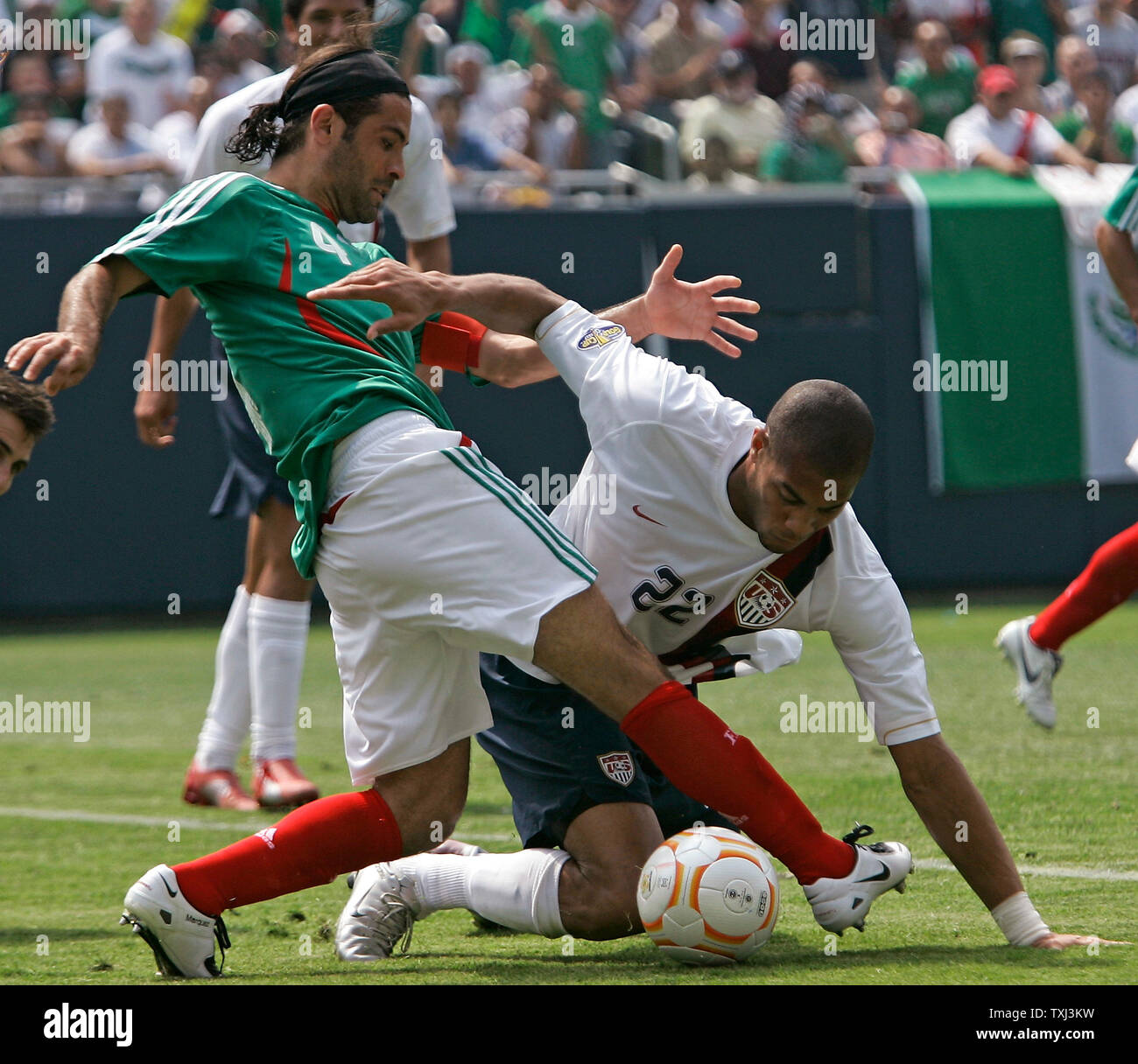 Mexico's Rafael Marquez (L) kicks the ball away from United States' Oguchi Onyewu during the second half of the CONCACAF Gold Cup final at Soldier Field in Chicago on June 24, 2007. The United States won 2-1. (UPI Photo/Brian Kersey) Stock Photo