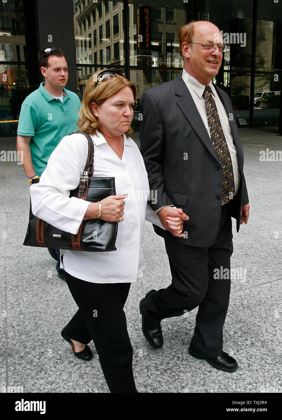 Former Hollinger International chief financial officer John Boultbee (R), co-defendant of Conrad Black, leaves federal court after being convicted in his fraud trial in Chicago on July 13, 2007. Boultbee was found guilty on three mail fraud charges which carry up to a five-year sentence for each charge. Black was found guilty on the same three charges and also one charge of obstruction of justice and faces up to 35 years in prison. (UPI Photo/Brian Kersey) Stock Photo