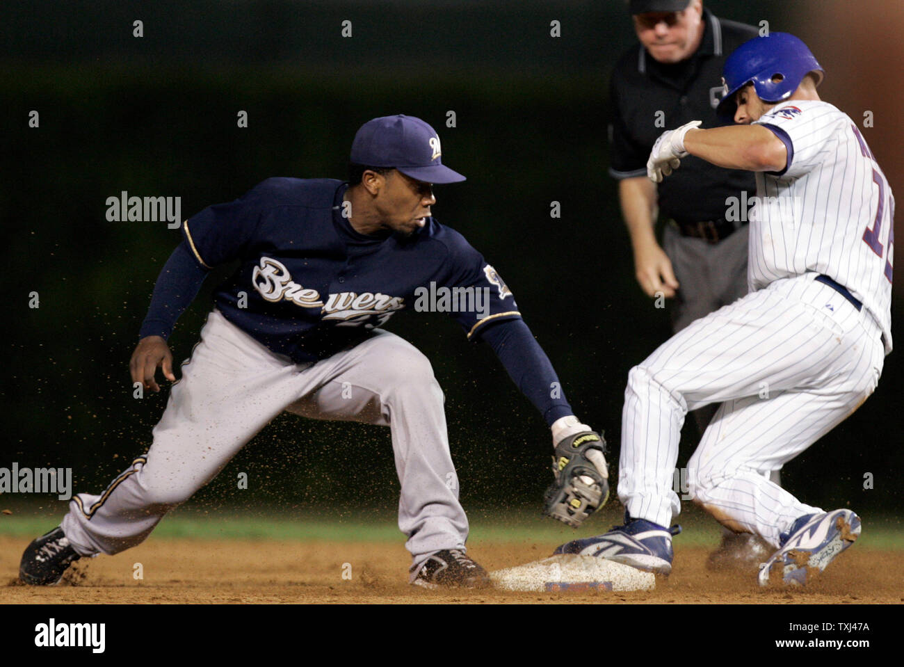 Chicago Cubs catcher Jason Kendall (18) slides in under the tag by