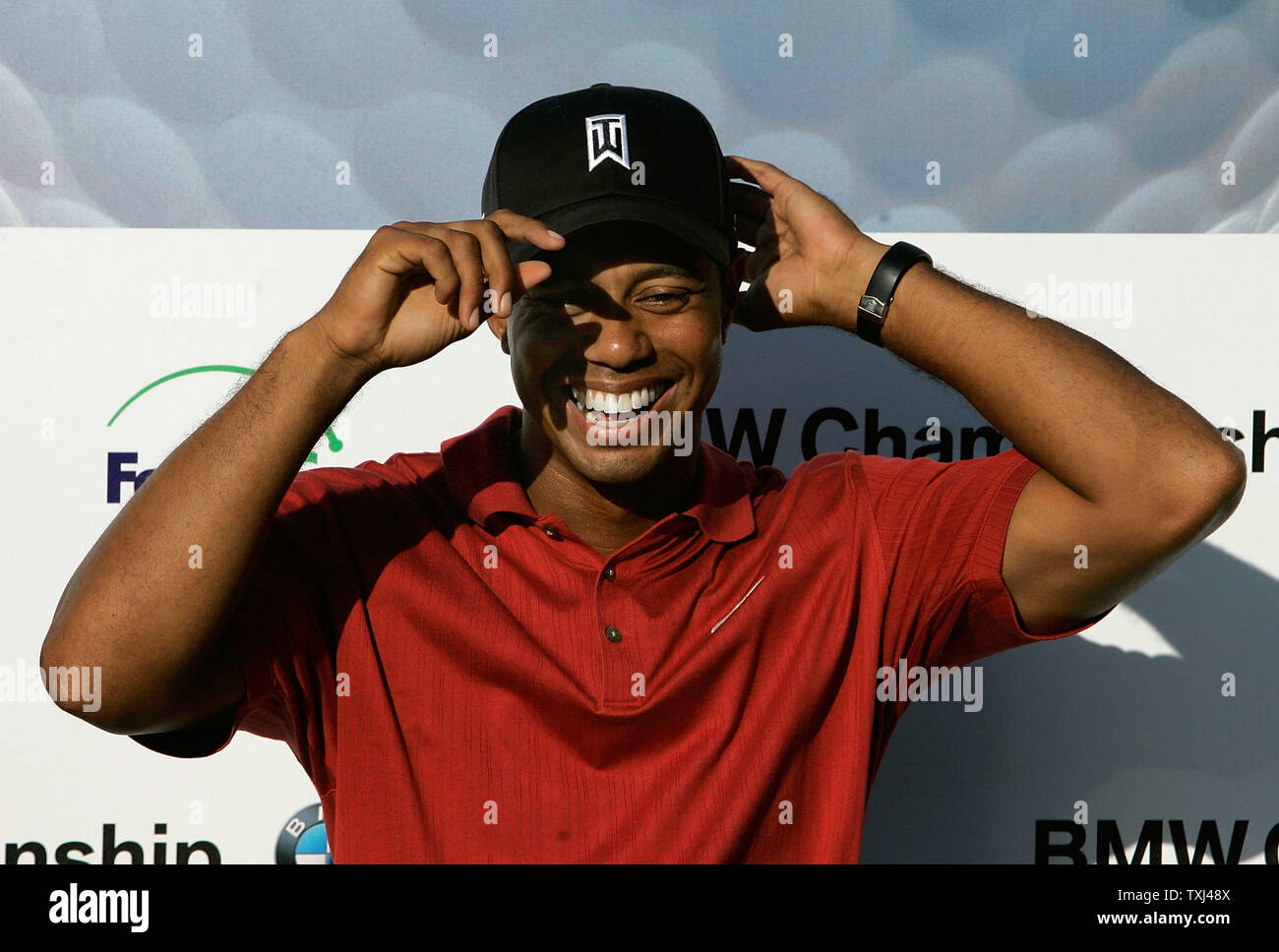 Tiger Woods adjusts his cap before acception the trophy after winning of the BMW Championship at Cog Hill Golf and Country Club in Lemont, Illinois on September 9, 2007. Woods finished with a 22-under par 262 for the four rounds of the tournament. (UPI Photo/Brian Kersey) Stock Photo