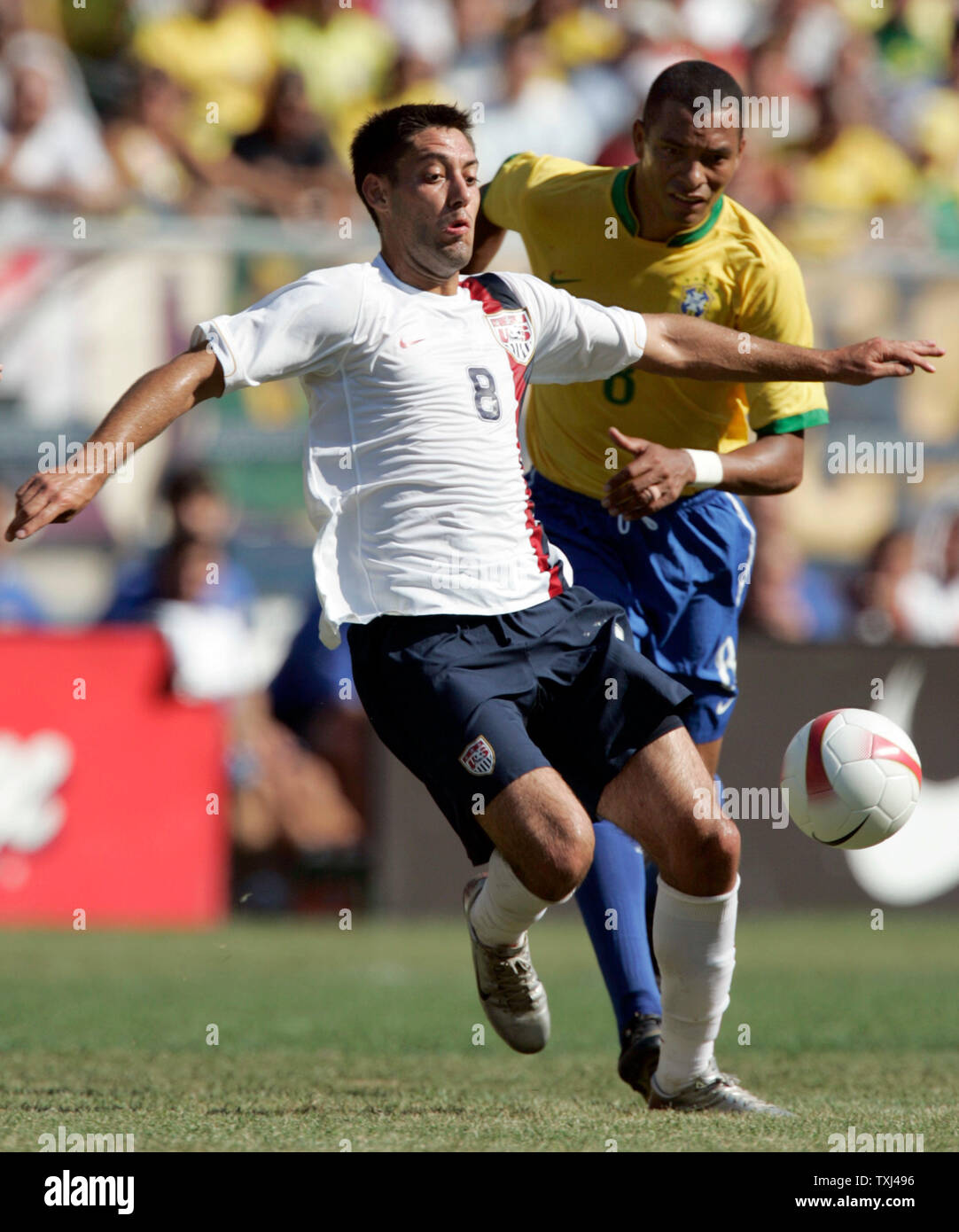 USA forward Clint Dempsey (8) blocks Brazil midfielder Gilberto Silva (R) as he brings the ball upfield. Brazil defeated the USA 4-2 in their international friendly soccer match at Soldier Field in Chicago, September 9, 2007. (UPI Photo/Mark Cowan) Stock Photo