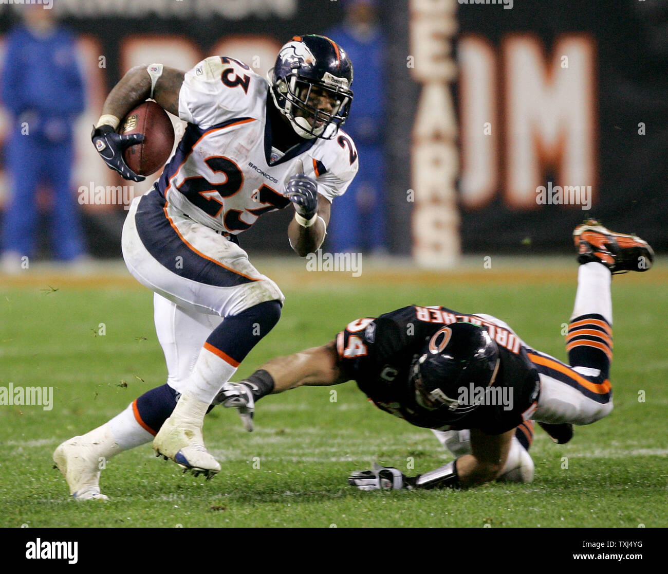 Denver Broncos running back Andre Hall (23) dodges Chicago Bears linebacker  Brian Urlacher (54) on his way to a 65-yard reception during the second  quarter at Soldier Field in Chicago on November