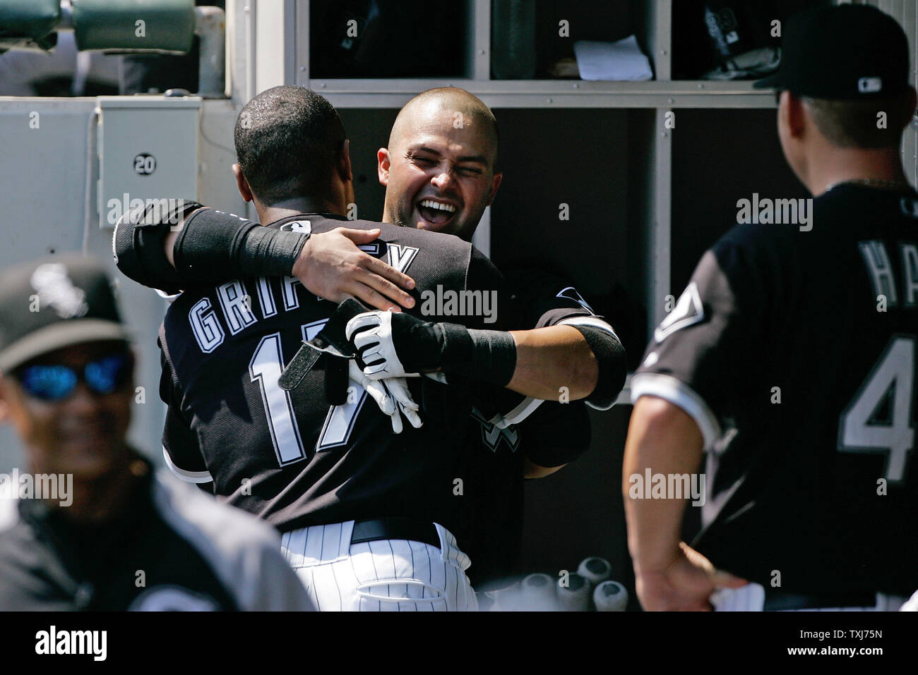 Chicago White Sox's Nick Swisher (R) hugs Ken Griffey Jr. after