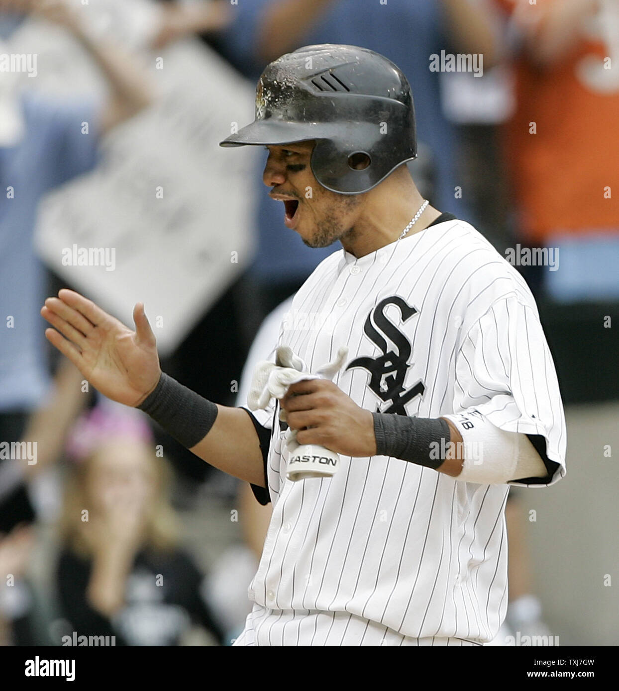 CHICAGO - APRIL 6: Scott Podsednik #22 of the Chicago White Sox swings to  hit the pitch against the Cleveland Indians at U.S. Cellular Field on April  6, 2005 in Chicago, Illinois.