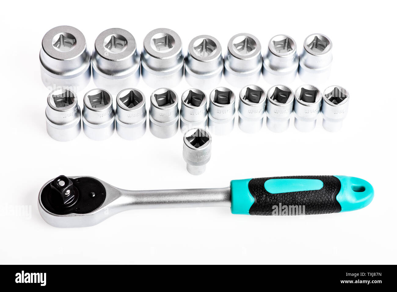 socket wrench isolated on white background. It is A Promise. various wrench heads and tips. Toolbox, tools kit detail close up. Socket Spanner Wrench. Socket set with ratchet in the toolbox Stock Photo