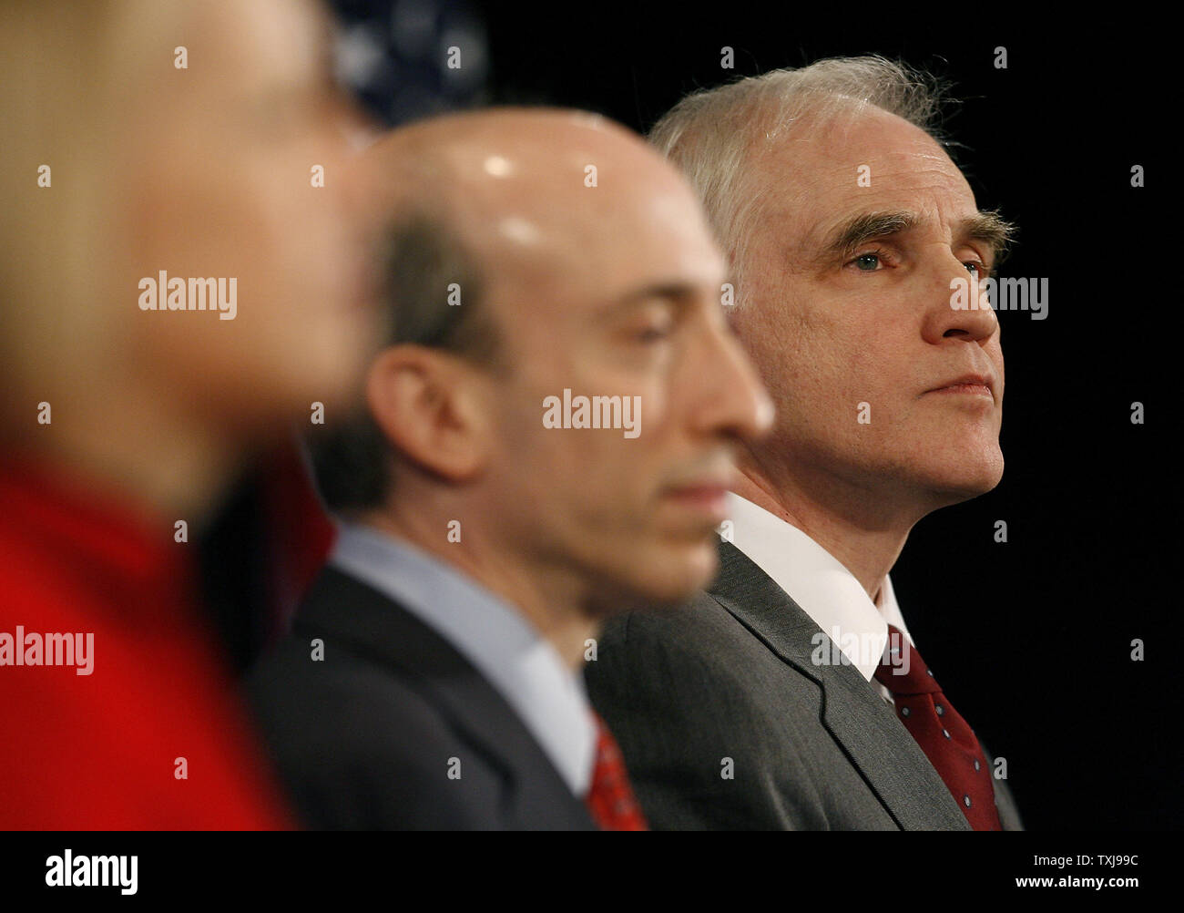 Daniel Tarullo (R), a new member of the Federal Reserve board, stands with Gary Gensler (C), the new head of the Commodity Futures Trading Commission, and Mary Schapiro, the new head the of the Securities and Exchange Commission, during a news conference at which President-elect Barack Obama introduced the three on December 18, 2008 in Chicago.  By appointing these non-cabinet positions at this early date, Obama stressed the importance of reforming regulations governing Wall Street to prevent future economic crises. (UPI Photo/Brian Kersey) Stock Photo