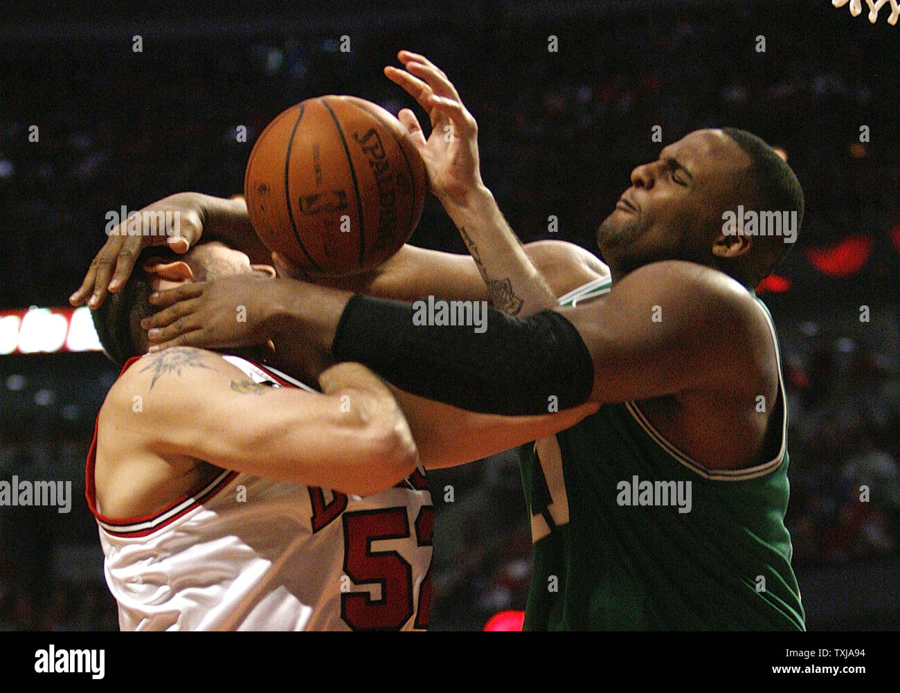 Boston Celtics' Glen Davis (R) fouls Chicago Bulls' Brad Miller as he goes  up for a shot during the fourth quarter of game 4 of their NBA Eastern  Conference Quarterfinal at the