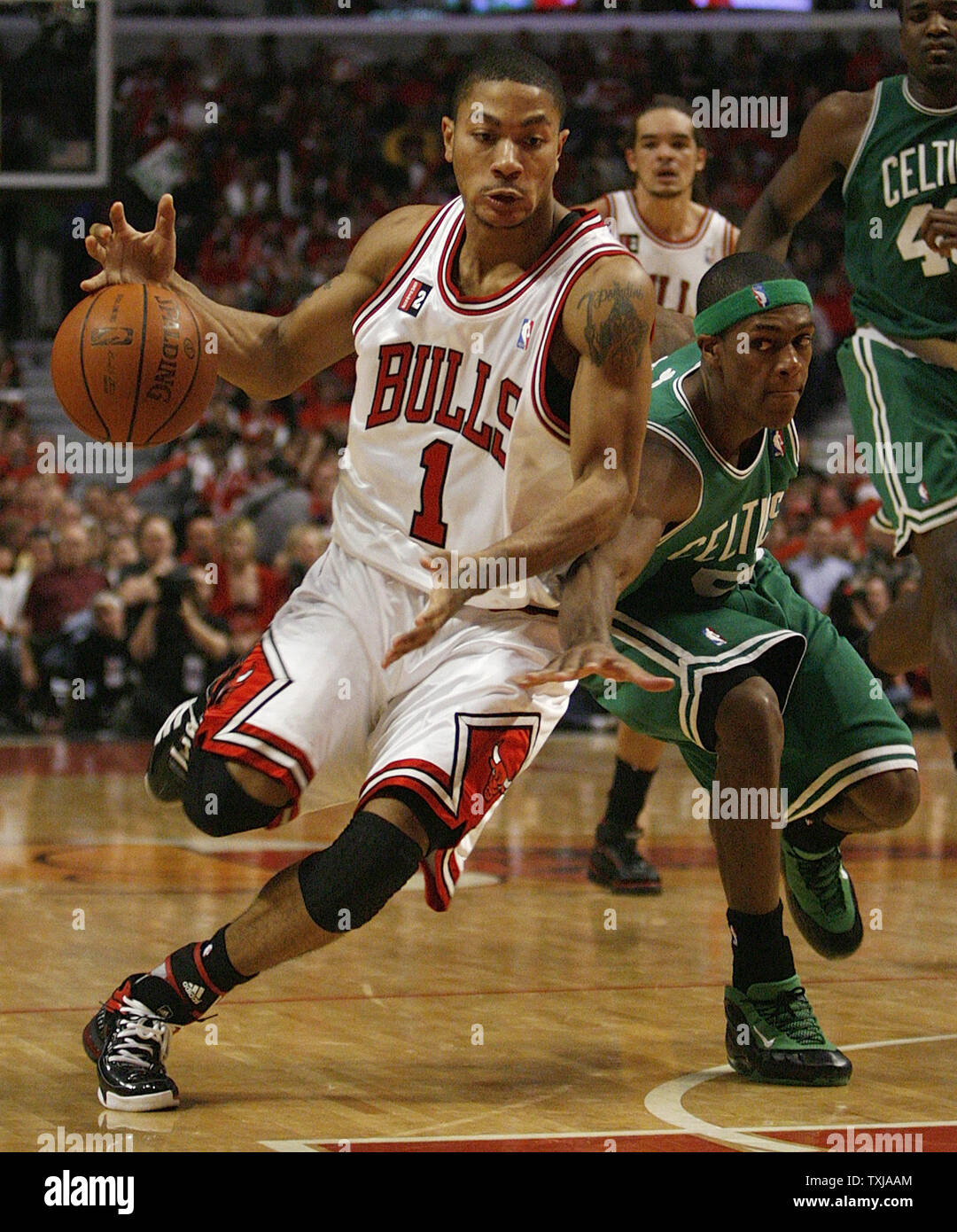 Derrick Rose in green St. Patrick's Day Bulls uniform with Deron Williams.  #nba