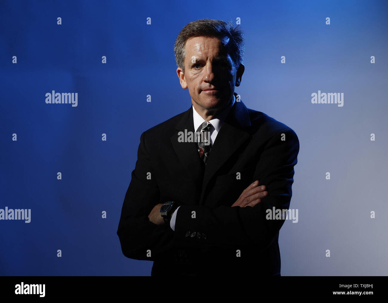 Women's Ice Hockey coach Mark Johnson poses for a portrait at the 2010