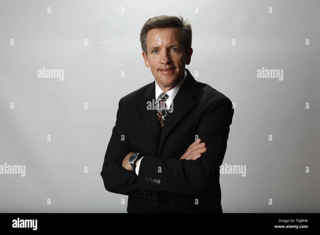 Women's Ice Hockey coach Mark Johnson poses for a portrait at the 2010