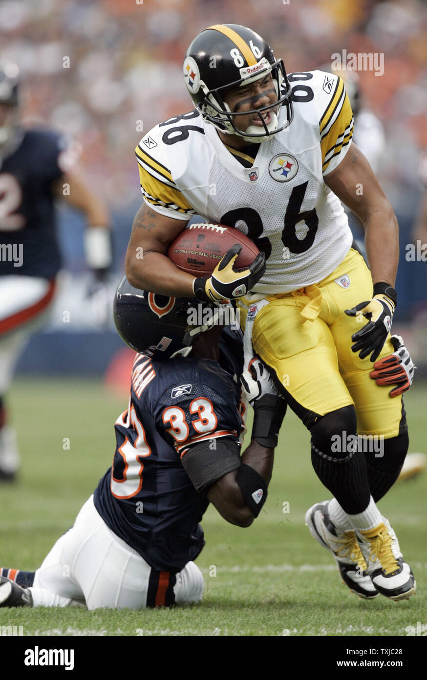 Chicago Bears cornerback Charles Tillman (33) tackles Pittsburgh Steelers wide receiver Hines Ward (86) during the first quarter at Soldier Field in Chicago on September 20, 2009. UPI /Mark Cowan Stock Photo
