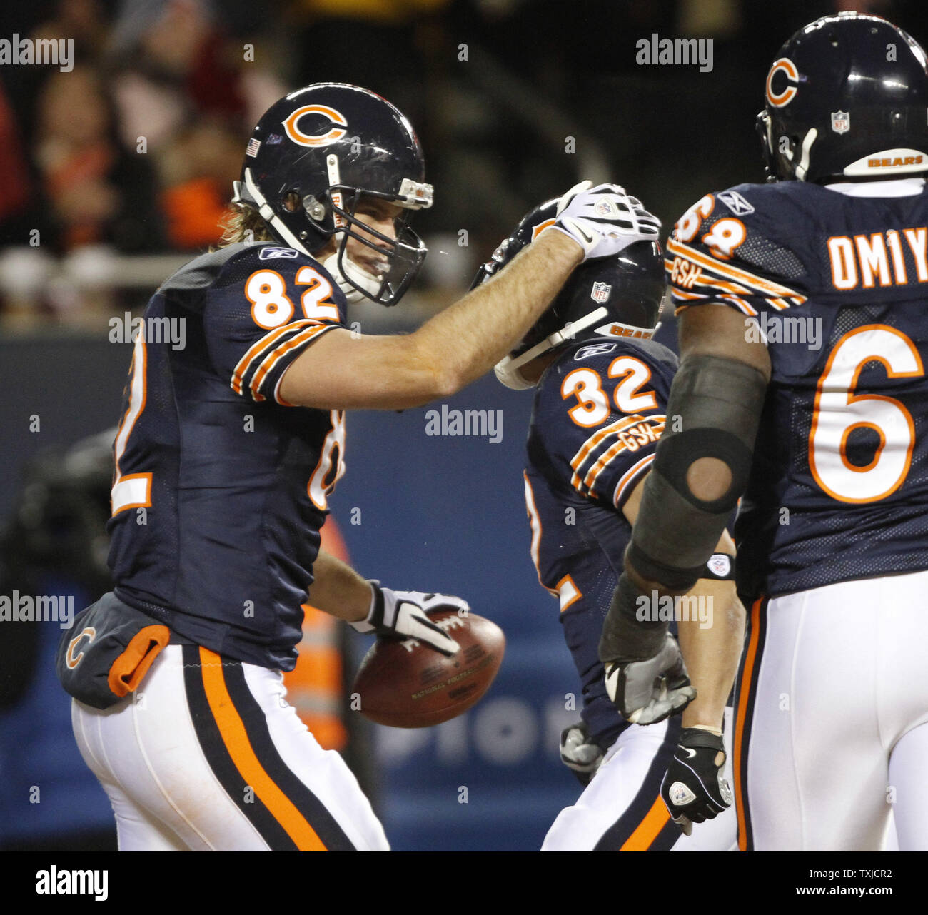 Chicago Bears tight end Greg Olsen (82) is taken down by New Orleans Saints  cornerback Usama Young after a 12-yard reception during the third quarter  at Soldier Field in Chicago on December