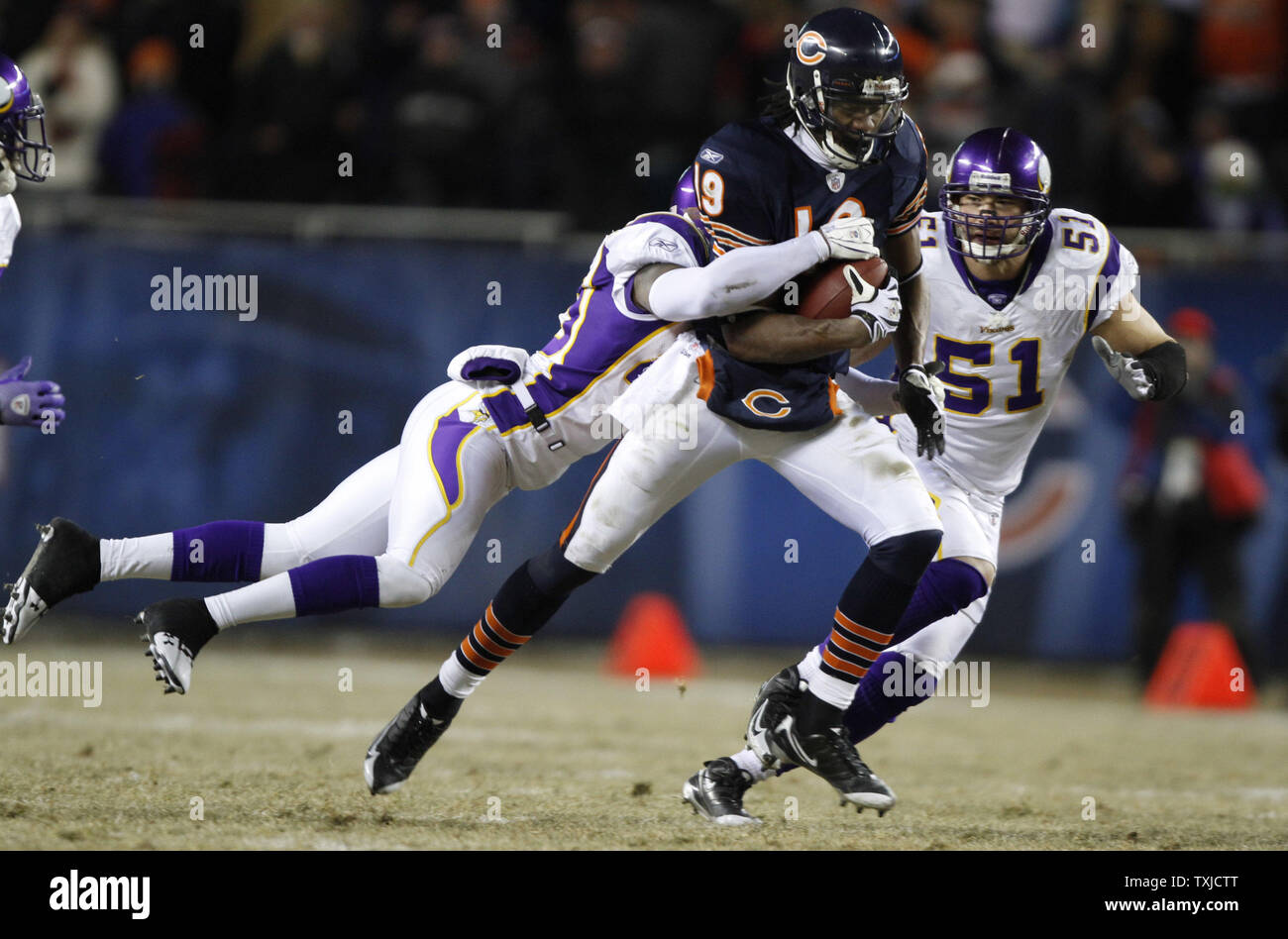 chicago-bears-wide-receiver-devin-aromashodu-is-tackled-by-minnesota-vikings-safety-madieu-williams-after-a-33-yard-reception-during-the-fourth-quarter-at-soldier-field-in-chicago-on-december-28-2009-the-bears-won-36-30-in-overtime-upibrian-kersey-TXJCTT.jpg