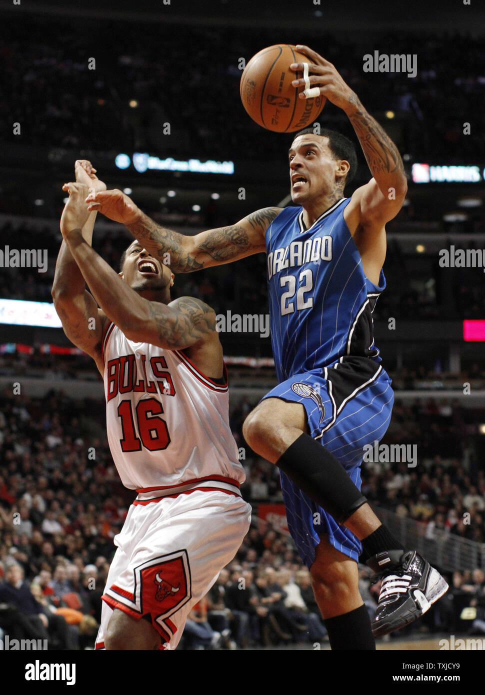 Orlando Magic forward Matt Barnes (R) drives to the basket as Chicago Bulls  forward James Johnson defends during the third quarter at the United Center  in Chicago on January 2, 2010. The