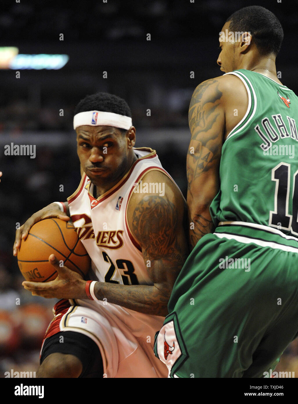 Cleveland Cavaliers LeBron James drives on Chicago Bulls James Johnson during the second quarter at the United Center in Chicago on March 19 2010. UPI Brian Kersey Stock Photo Alamy