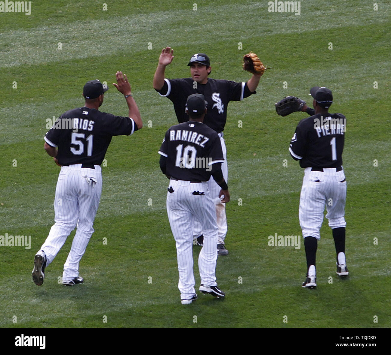 Chicago White Sox' Alex Rios (51), Alexei Ramirez (10), Juan Pierre and Carlos Quentin celebrate their Opening Day win against the Cleveland Indians at U.S. Cellular Field in Chicago on April 5, 2010. The White Sox won 6-0.     UPI/Brian Kersey Stock Photo