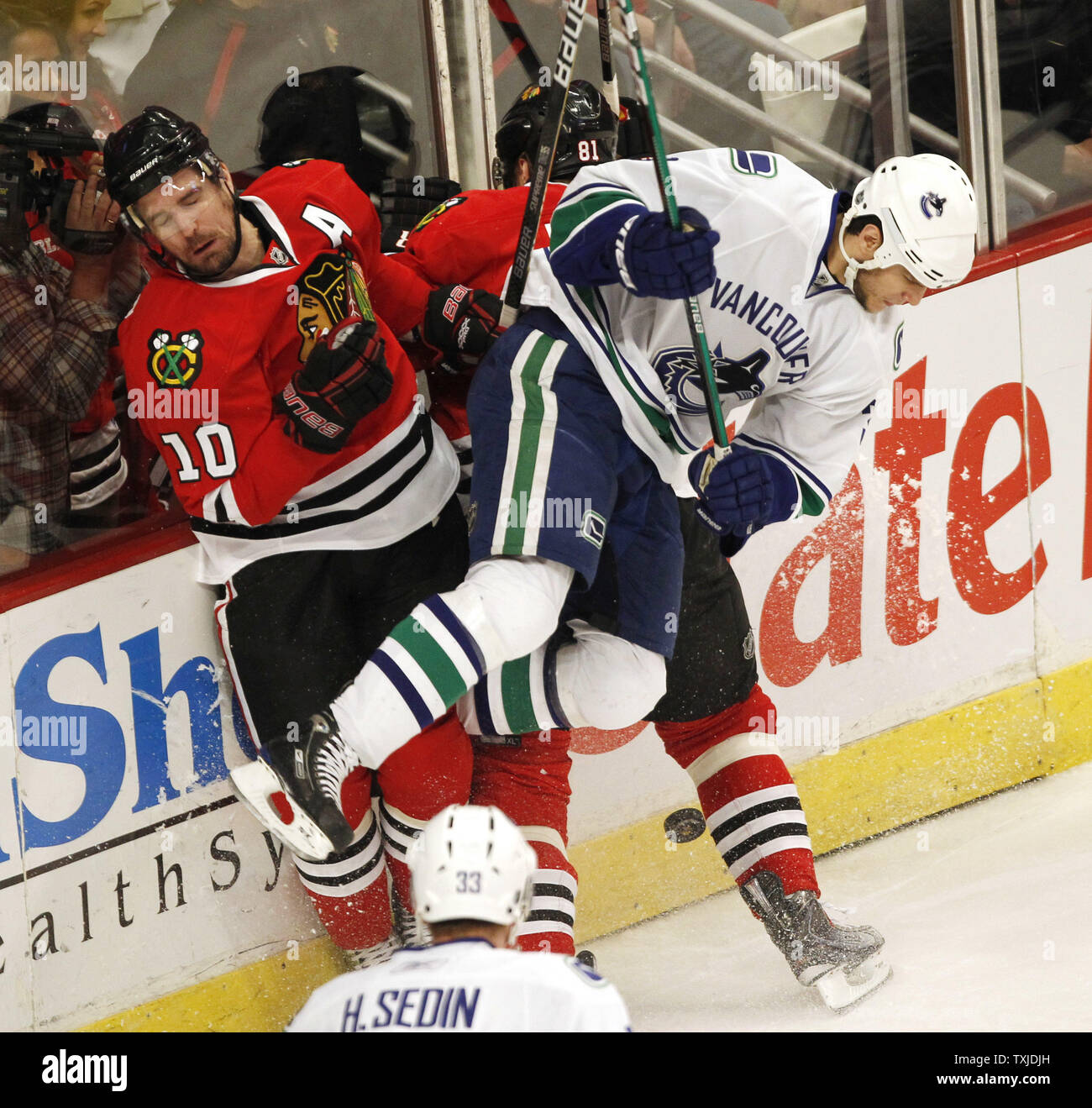 Vancouver Canucks Kevin Bieksa pulls Chicago Blackhawks Karl Stewart's  jersey over his head in a fight during the third period at Vancouver's GM  Place, February 7, 2007. The Blackhawks won 3-0.(UPI Photo/Heinz