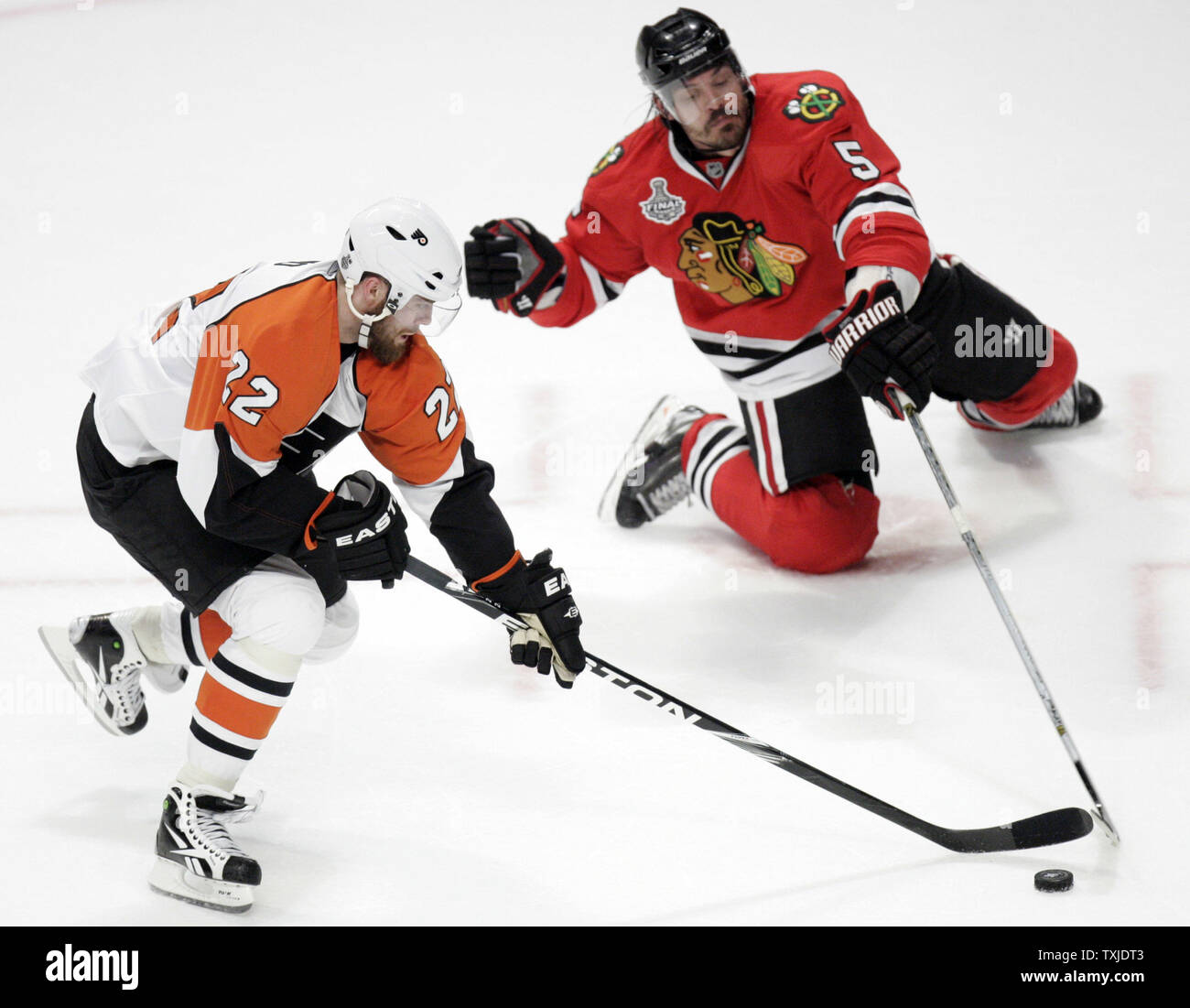 Philadelphia Flyers left wing Ville Leino (22) tries to bring the puck up the ice past Chicago Blackhawks defenseman Brent Sopel (5) during the third period of game 2 of the 2010 Stanley Cup Final at the United Center in Chicago, May 31, 2010. The Blackhawks defeated the Flyers 2-1 to take a 2-0 lead in the best of seven series. (UPI Photo/Mark Cowan) Stock Photo