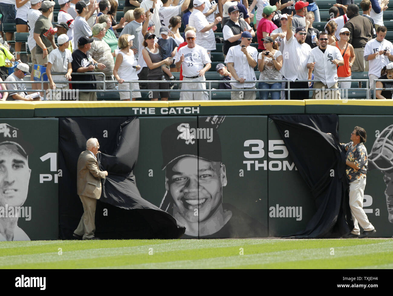 White Sox catcher Carlton Fisk reaches out to fans following the last game  at the old Comiskey Park on Sept. 30, 1990. – Reading Eagle