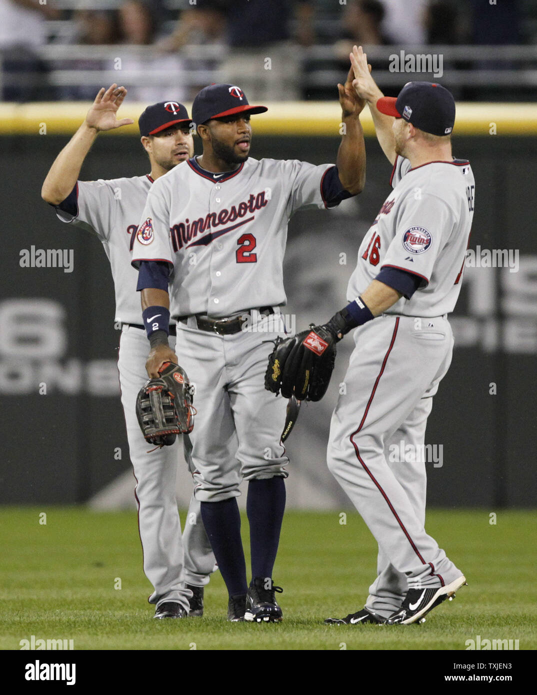 Minnesota Twins left fielder Jason Repko (L), center fielder Denard Span  (C), and Minnesota Twins right fielder Jason Kubel celebrate their 9-3 win  over the Chicago White Sox at U.S. Cellular Field