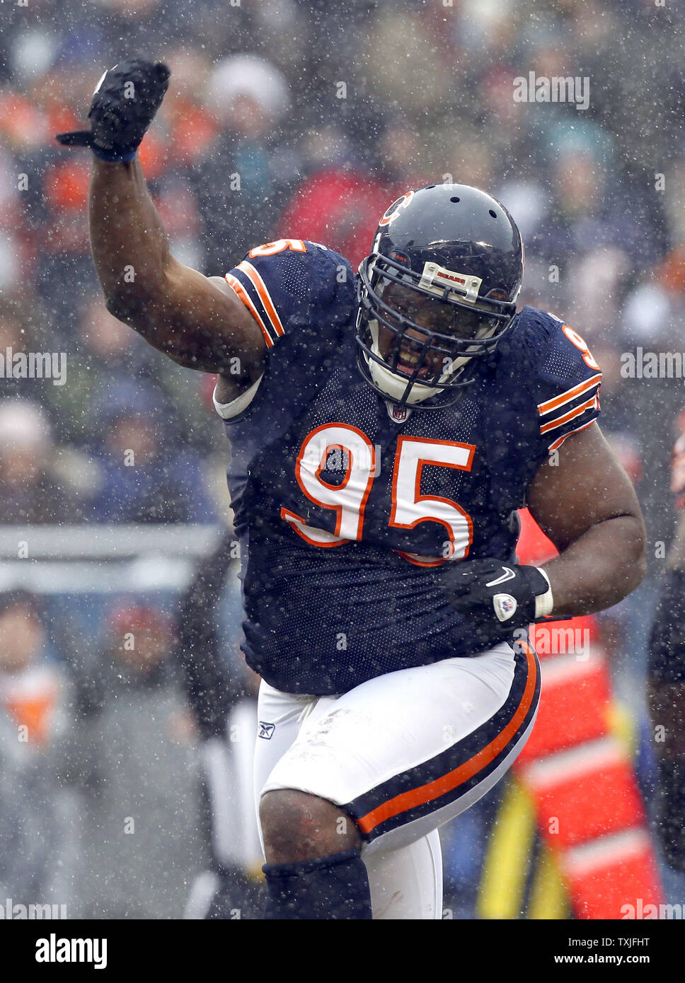 Chicago Bears defensive tackle Anthony Adams (95) celebrates forcing a  fumble against the New York Jets during the first quarter of their game at  Soldier Field in Chicago on December 26, 2010.