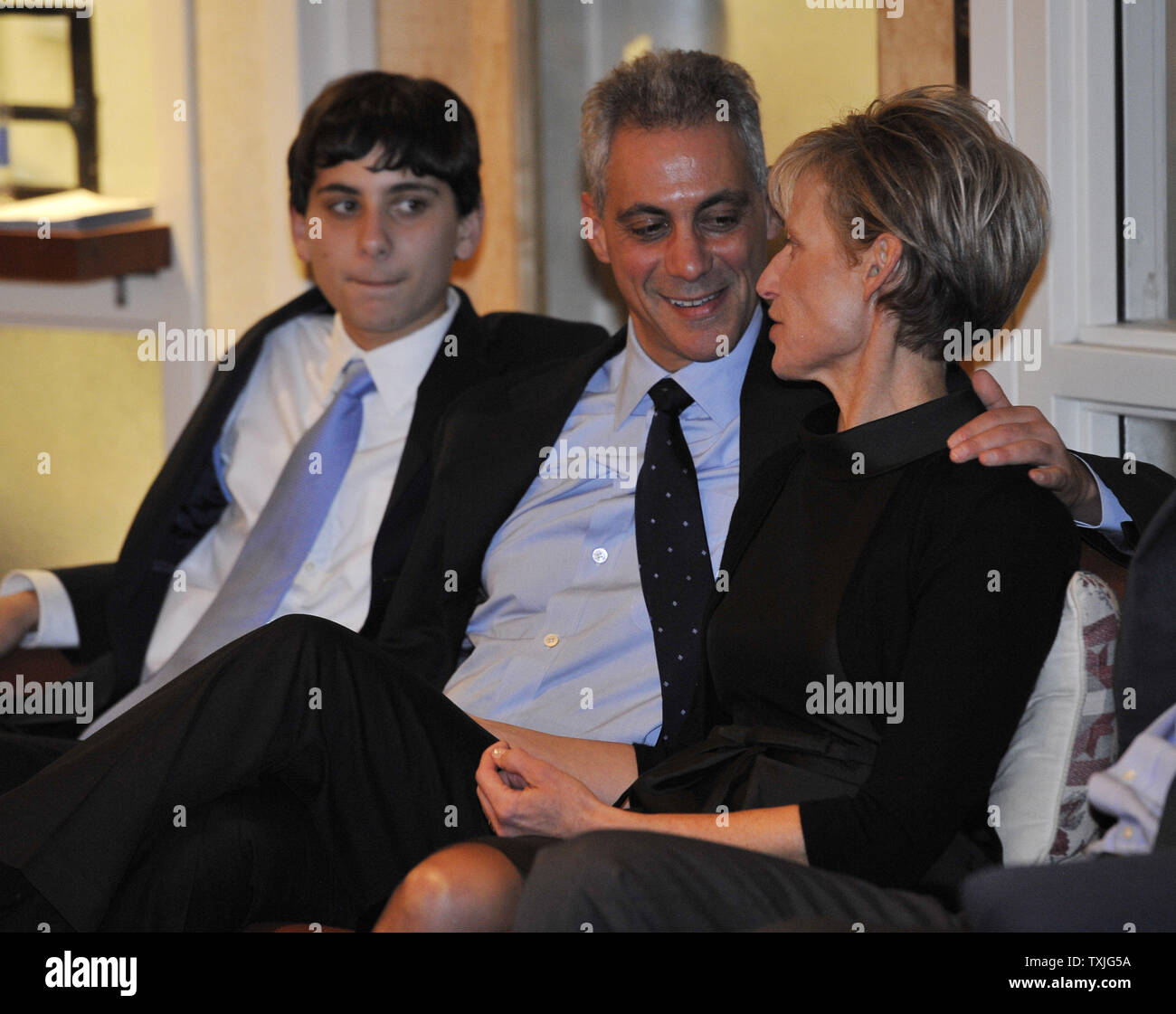 Chicago Mayoral candidate Rahm Emanuel (C) watches election returns with his son Zach (L) and wife Amy Rule before an election-night rally in Chicago on February 22, 2011.       UPI/Brian Kersey Stock Photo