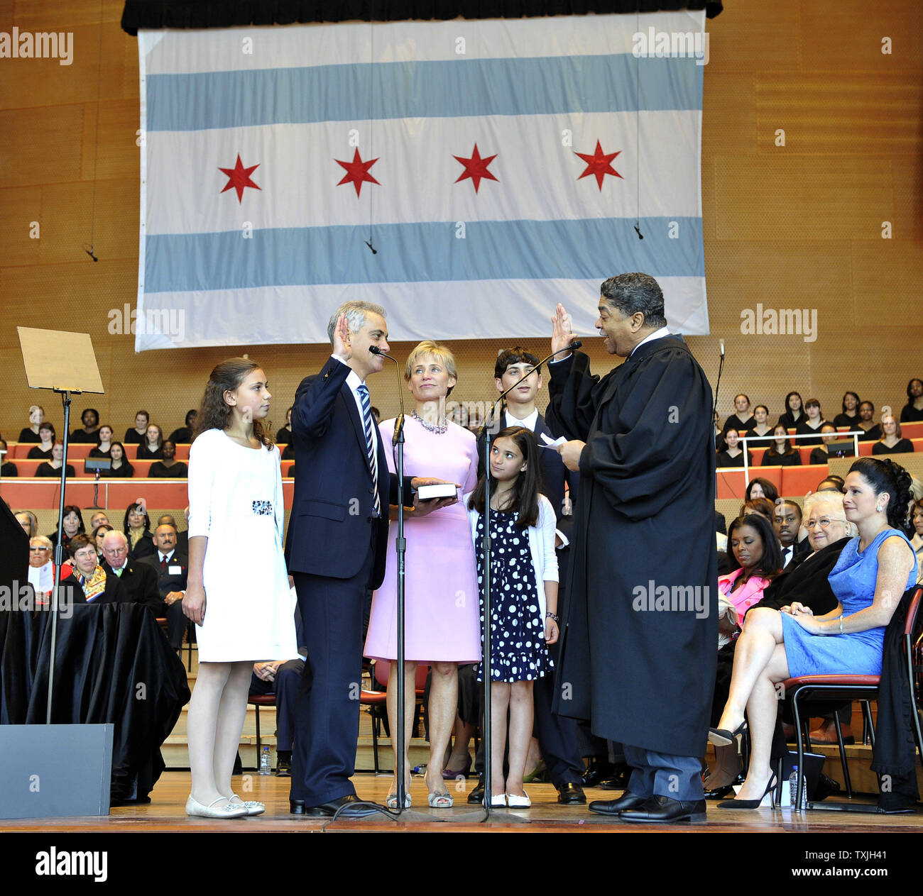 Rahm Emanuel accompanied by his daughter Ilana (L-R) wife Amy Rule, daughter Leah and son Zach, is sworn as mayor of Chicago by Cook County Circuit Court Judge Timothy Evans (R) during an inaugural ceremony at Millennium Park on May 16, 2011. Emanuel takes over for Richard M. Daley, who had served in the post since 1989.     UPI/Brian Kersey Stock Photo