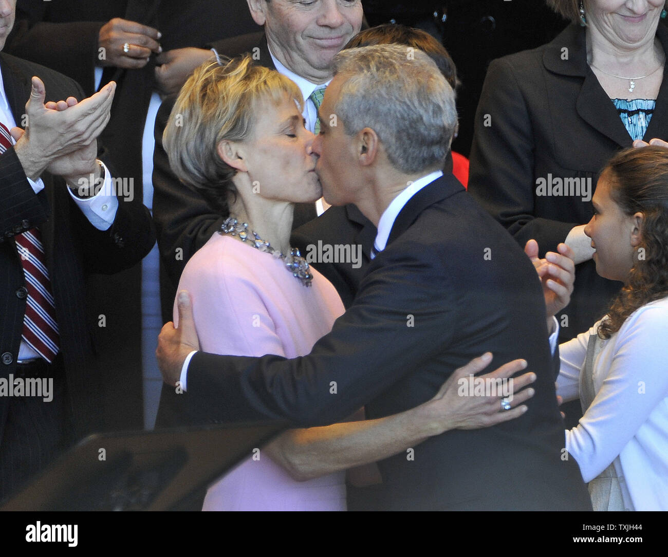 Rahm Emanuel (R) kisses his wife Amy Rule after taking the oath of office as mayor of Chicago during an in inaugural ceremony at Millennium Park on May 16, 2011. Emanuel takes over for Richard M. Daley, who had served in the post since 1989.     UPI/Brian Kersey Stock Photo