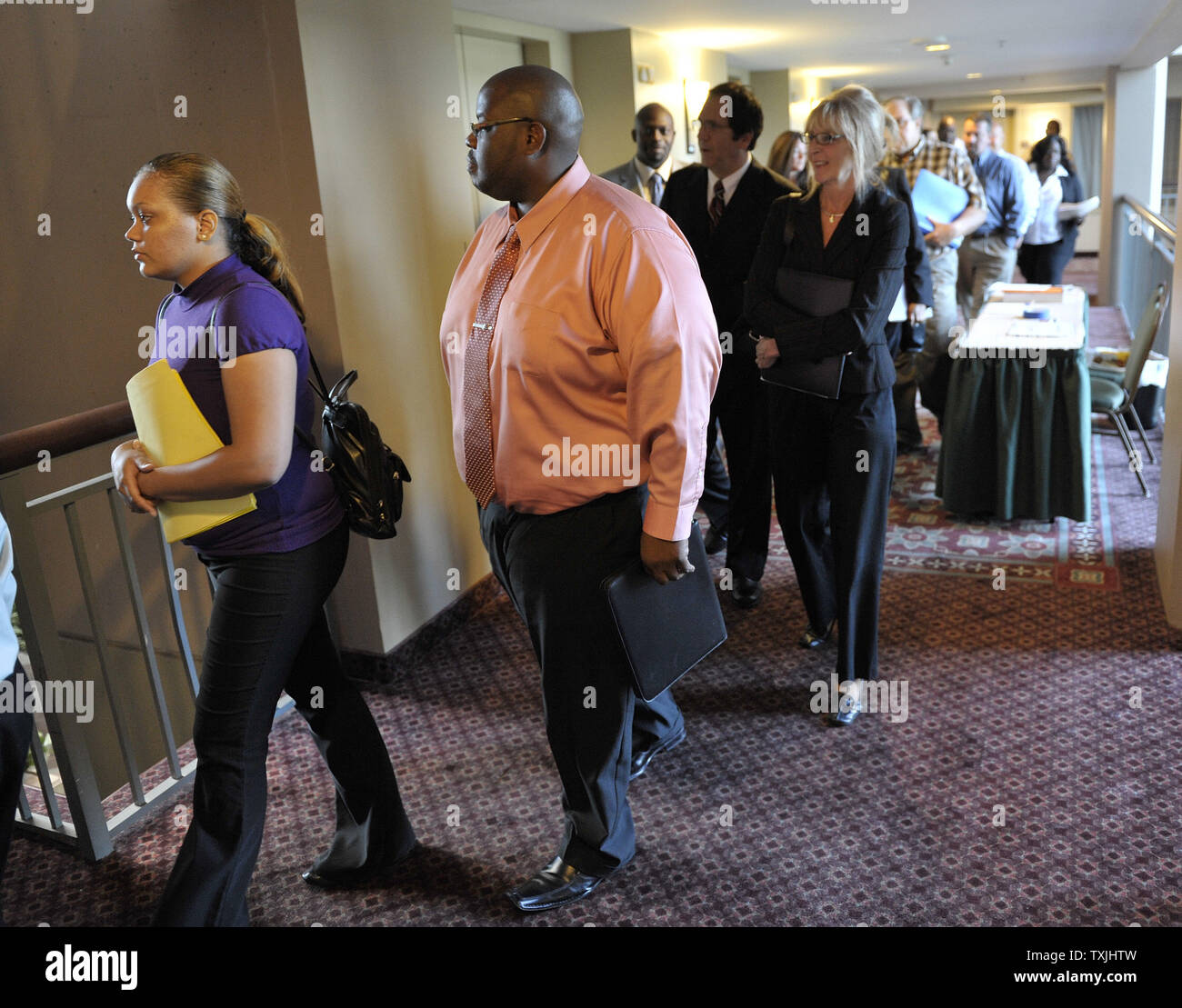 Employment seekers line up as a job fair  opens on August 24, 2011 in Lombard, Illinois. The seasonably adjusted unemployment rate for Illinois is at 9.5 percent as jobs and job creation continue to be a hot political issue.    UPI/Brian Kersey Stock Photo