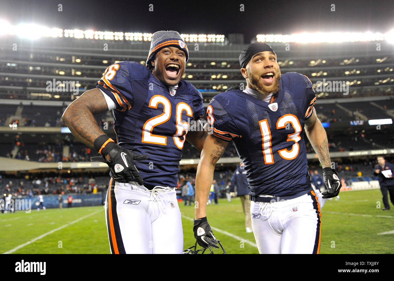 Chicago Bears cornerback Tim Jennings (L) and wide receiver Johnny Knox run  off the field after their game against the San Diego Chargers at Soldier  Field on November 20, 2011 in Chicago.
