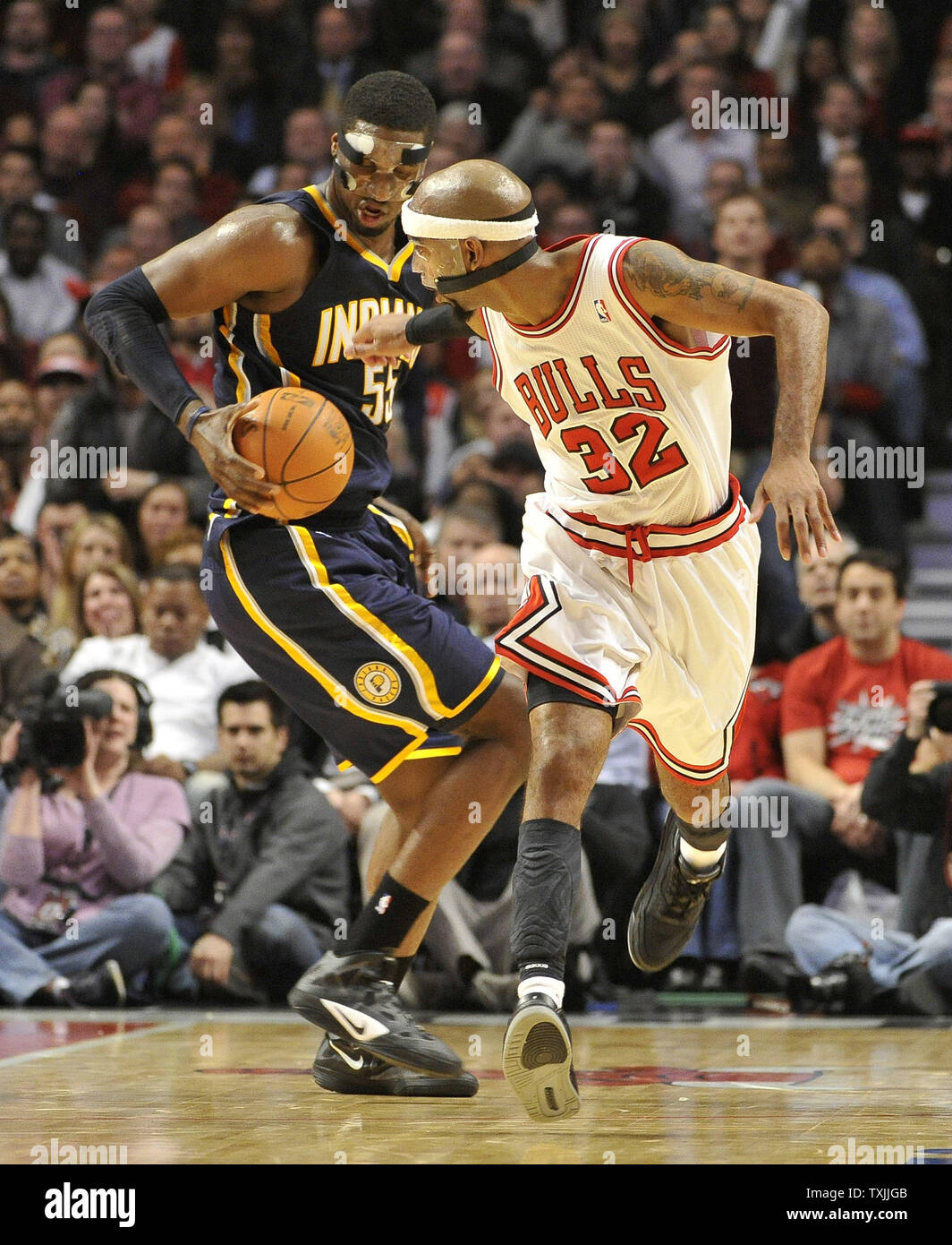 Indiana Pacers center Roy Hibbert (L) grabs a loose ball away from Chicago Bulls guard Richard Hamilton during the fourth quarter at the United Center on January 25, 2012 in Chicago. The Pacers won 95-90.     UPI/Brian Kersey Stock Photo