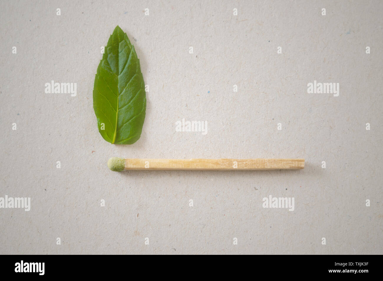 Green match with green flame Stock Photo Alamy
