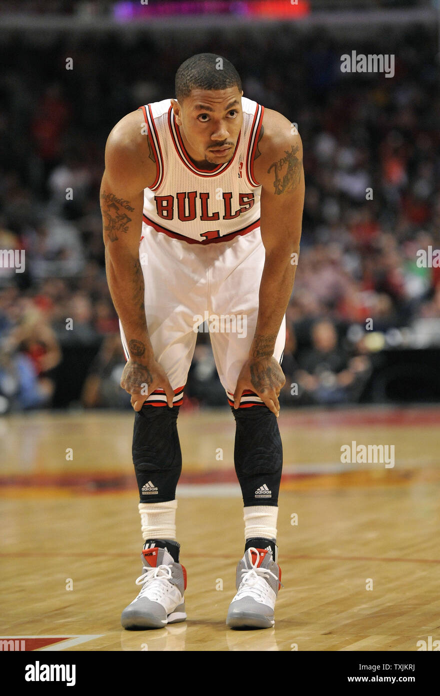 Chicago Bulls guard Derrick Rose stands on the court during the fourth  quarter against the Dallas