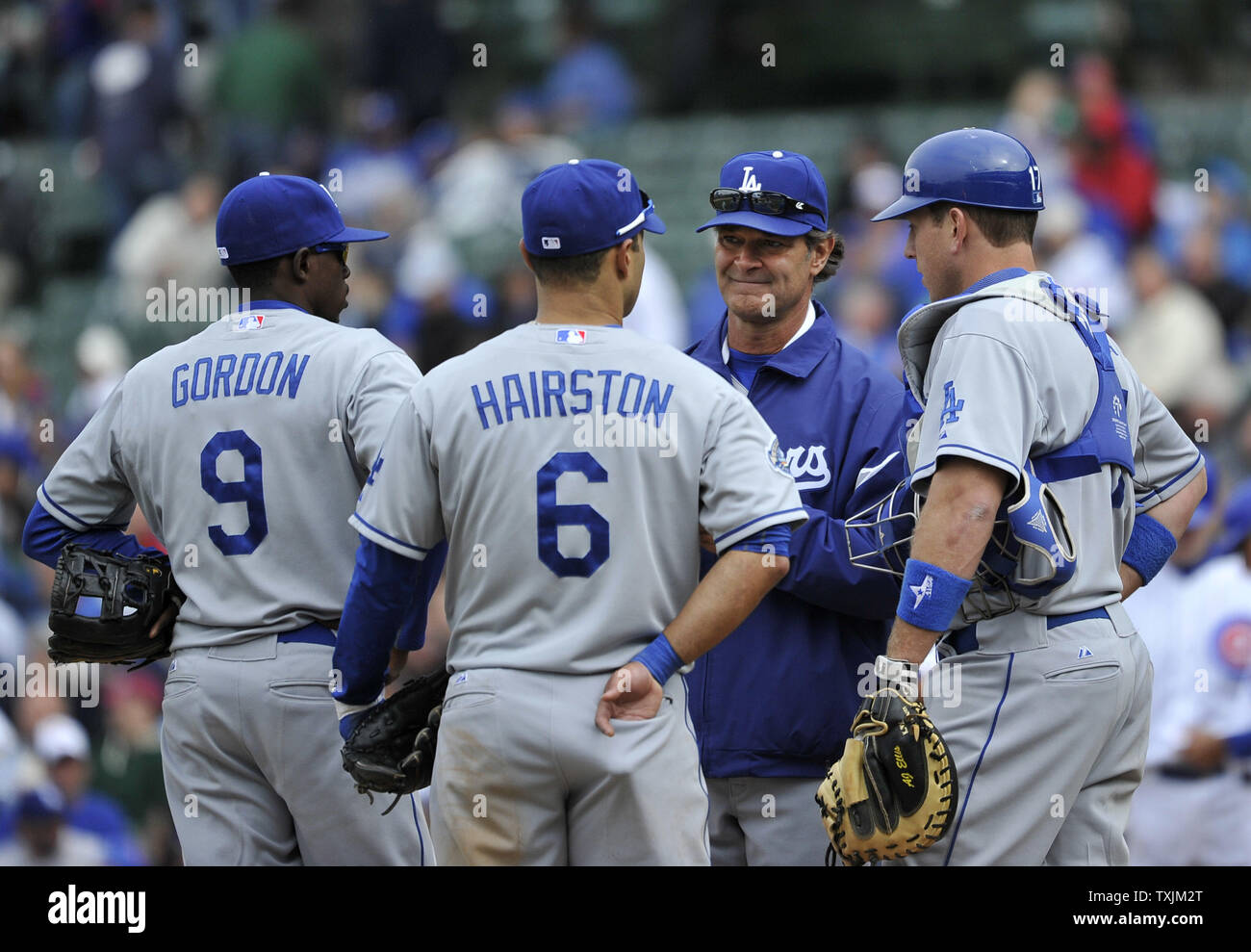 Los Angeles Dodgers manager Don Mattingly (second right) stands on