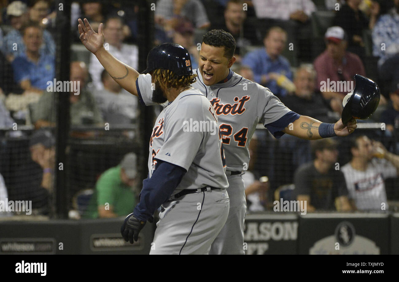 Andy Dirks and Quintin Berry celebrate a run in Game 2 of the ALCS