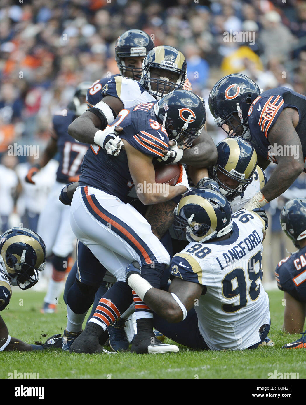 Seattle Seahawks running back Marshawn Lynch (24) runs past St. Louis Rams  defensive tackle Jermelle Cudjo for a seven yard gain in the third quarter  at CenturyLink Field in Seattle, Washington on