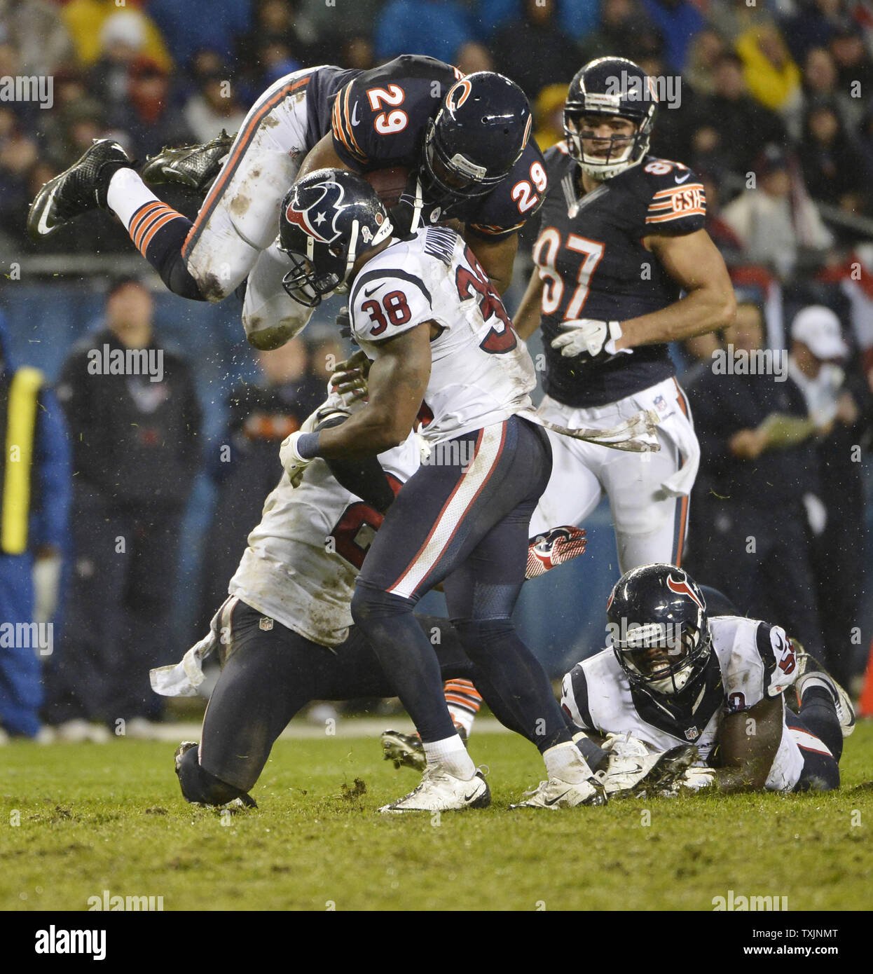 Chicago Bears running back Michael Bush (29) is upended by Houston Texans free safety Danieal Manning after a 20-yard run during the fourth quarter at Soldier Field on November 11, 2012 in Chicago. The Texans won 13-6.     UPI/Brian Kersey Stock Photo