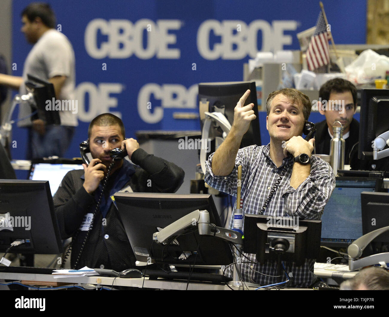 Traders work in the CBOE Volatility Index (VIX) pit at the Chicago Board Options Exchange on December 12, 2012 in Chicago. Stocks were rising after the Federal Reserve Open Market Committee announced it will keep the Fed Funds interest rate near zero until the 7.8 percent unemployment drops to 6.5 percent inflation increases to 2.5 percent from its current 2.2 percent rate. The FOMC also announced that it will purchase $45 billion a month in Treasury bonds and continue to buy $45 billion a month in mortgage-backed bonds to stimulate the economy.       UPI/Brian Kersey Stock Photo