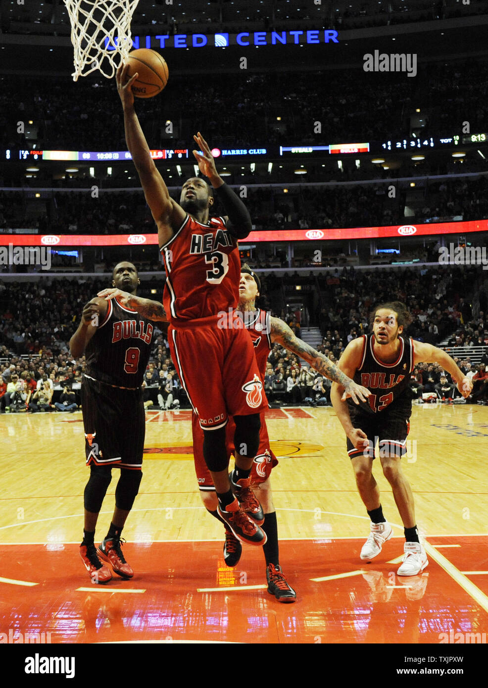 Miami Heat shooting guard Dwyane Wade (3) shoots past Chicago Bulls small forward Luol Deng (9) during the second half at the United Center in Chicago on February 21, 2013.     UPI/David Banks Stock Photo