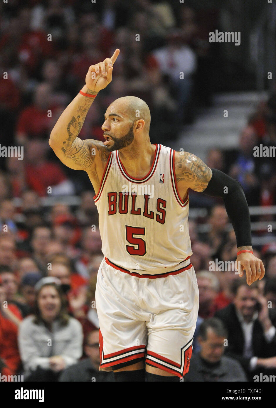 Chicago Bulls forward Carlos Boozer runs up the court after a score during  the first quarter of game 3 of the NBA Eastern Conference Quarterfinals  against the Brooklyn Nets during the 2013, image size:940x1390