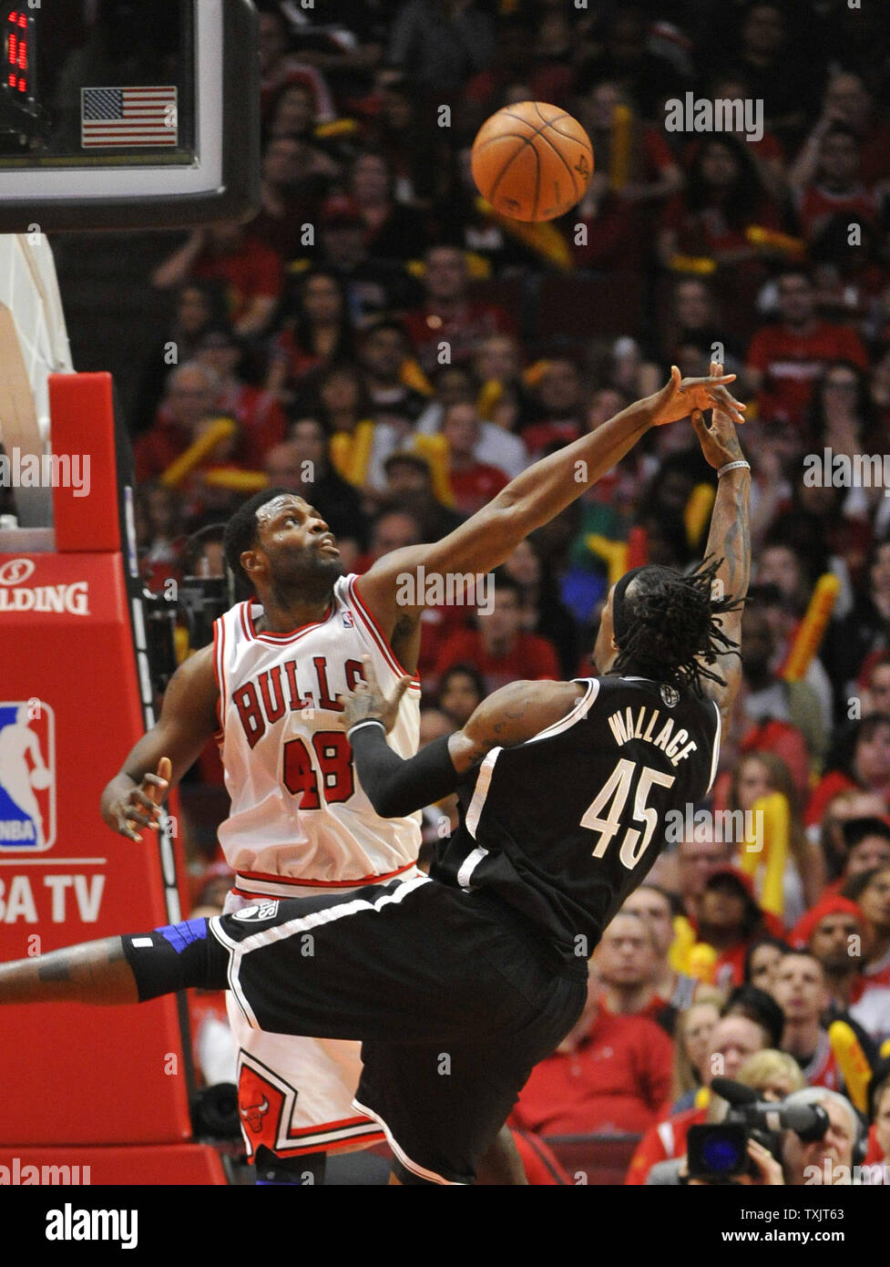 Chicago Bulls center Nazr Mohammed contests the shot ov Brooklyn Nets  forward Gerald Wallace during the fourth quarter of Game 4 of the NBA  Eastern Conference Quarterfinals during the 2013 NBA Playoffs, image size:977x1390