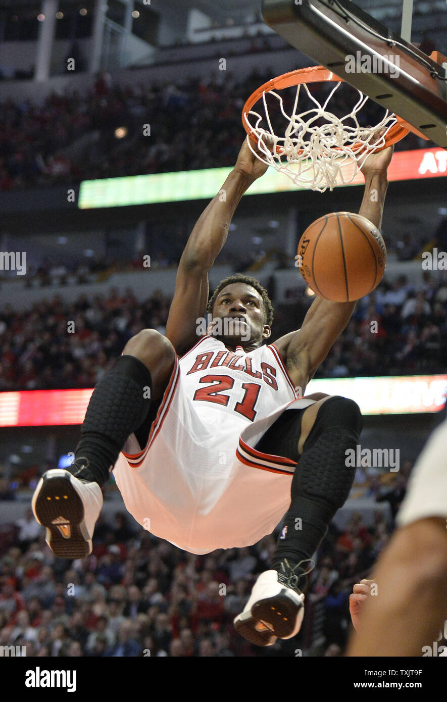 Chicago Bulls forward Jimmy Butler dunks during the third quarter of Game 6  of the NBA Eastern Conference Quarterfinals against the Brooklyn Nets  during the 2013 NBA Playoffs at the United Center, image size:885x1390