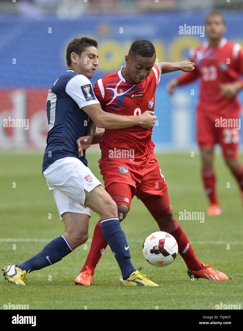 United States midfielder Alejandro Bedoya (L) and Panama forward Gabriel Torres go for the ball during the first half of the 2013 CONCACAF Gold Cup Final at Soldier Field in Chicago on July 28, 2013.     UPI/Brian Kersey Stock Photo