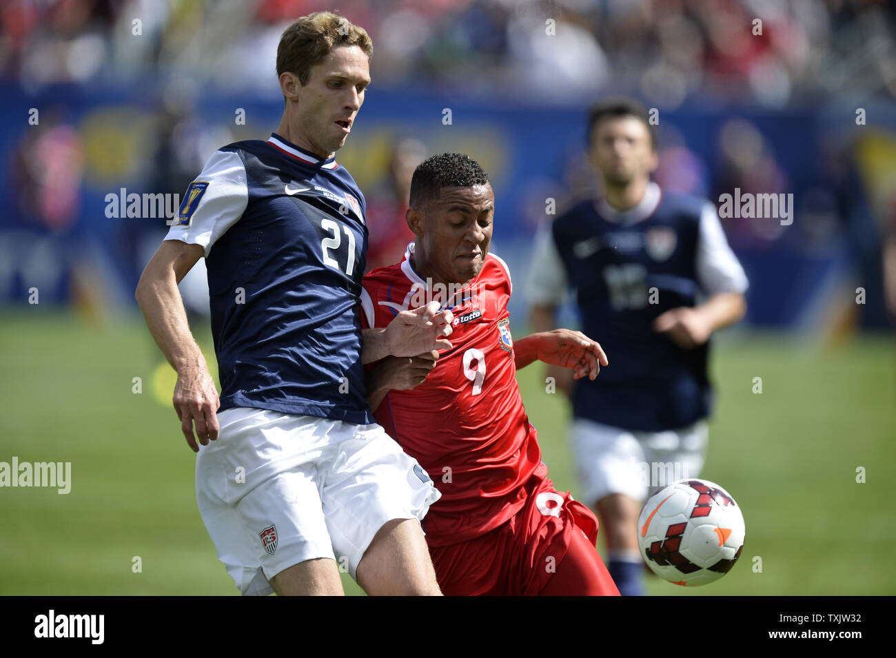 United States defender Clarence Goodson (L) and Panama forward Gabriel Torres go for the ball during the first half of the 2013 CONCACAF Gold Cup Final at Soldier Field in Chicago on July 28, 2013.     UPI/Brian Kersey Stock Photo