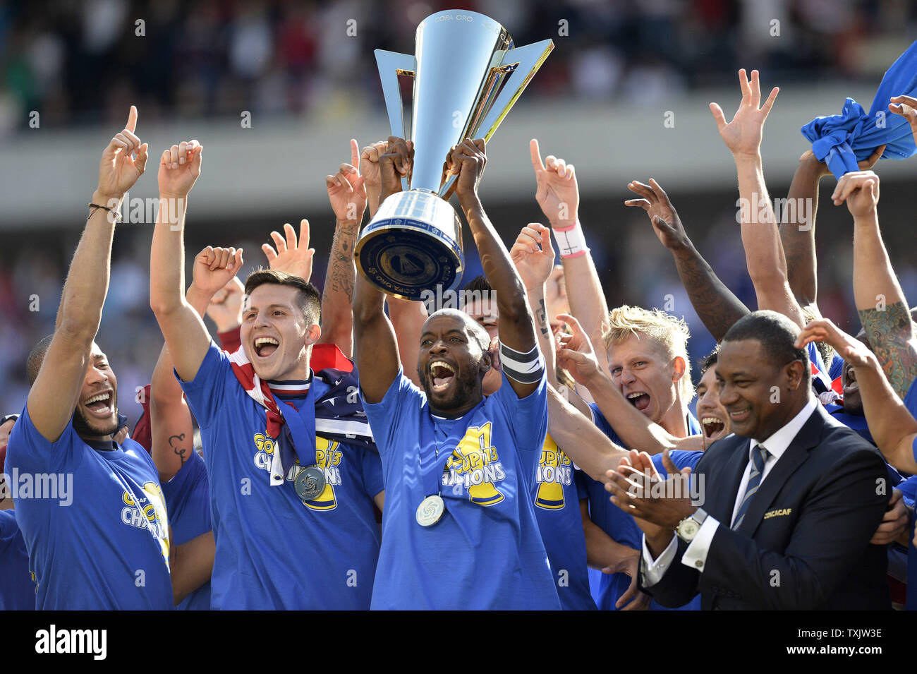 United States team captain DaMarcus Beasley (C) and his teammates celebrate after receiving the Gold Cup from CONCACAF President Jeffrey Webb after defeating Panama 1-0 in the 2013 CONCACAF Gold Cup Final at Soldier Field in Chicago on July 28, 2013.     UPI/Brian Kersey Stock Photo