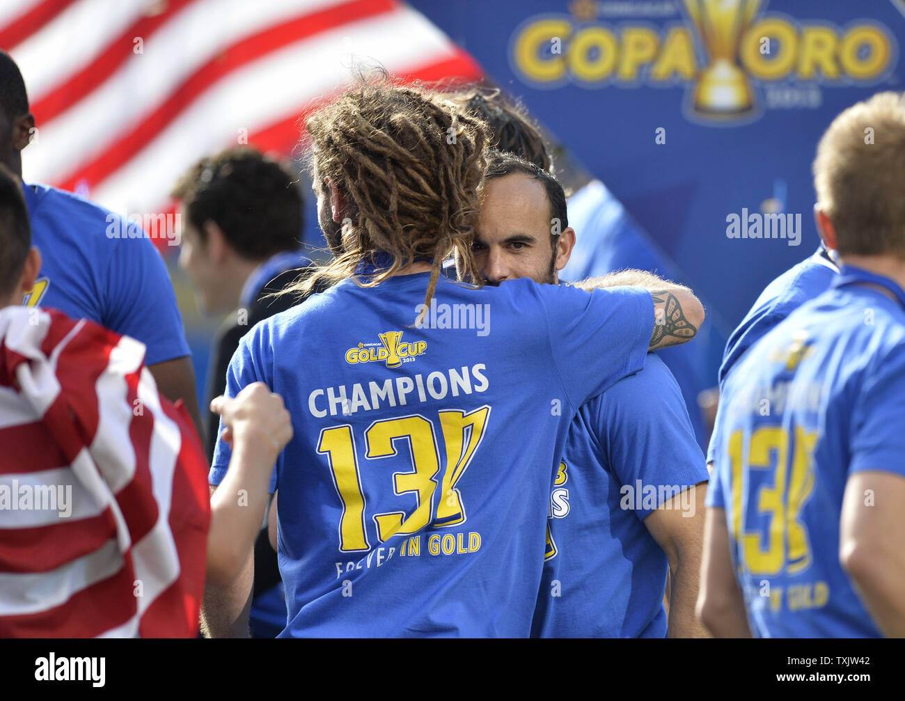 United States' Kyle Beckerman (L) hugs teammate Landon Donovan after they defeated Panama to win the 2013 CONCACAF Gold Cup Final at Soldier Field in Chicago on July 28, 2013. The United States won 1-0.     UPI/Brian Kersey Stock Photo