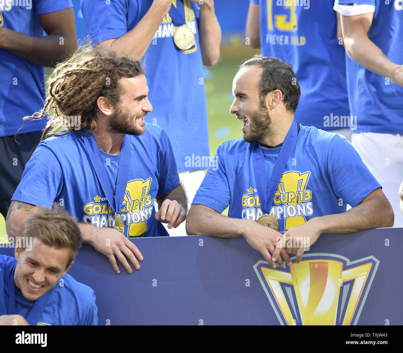 United States' Kyle Beckerman (L) talks with teammate Landon Donovan after defeating Panama in the 2013 CONCACAF Gold Cup Final at Soldier Field in Chicago on July 28, 2013. The United States won 1-0.     UPI/Brian Kersey Stock Photo